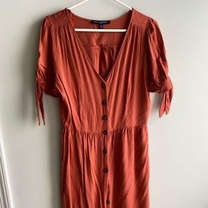 Orange button up dress.